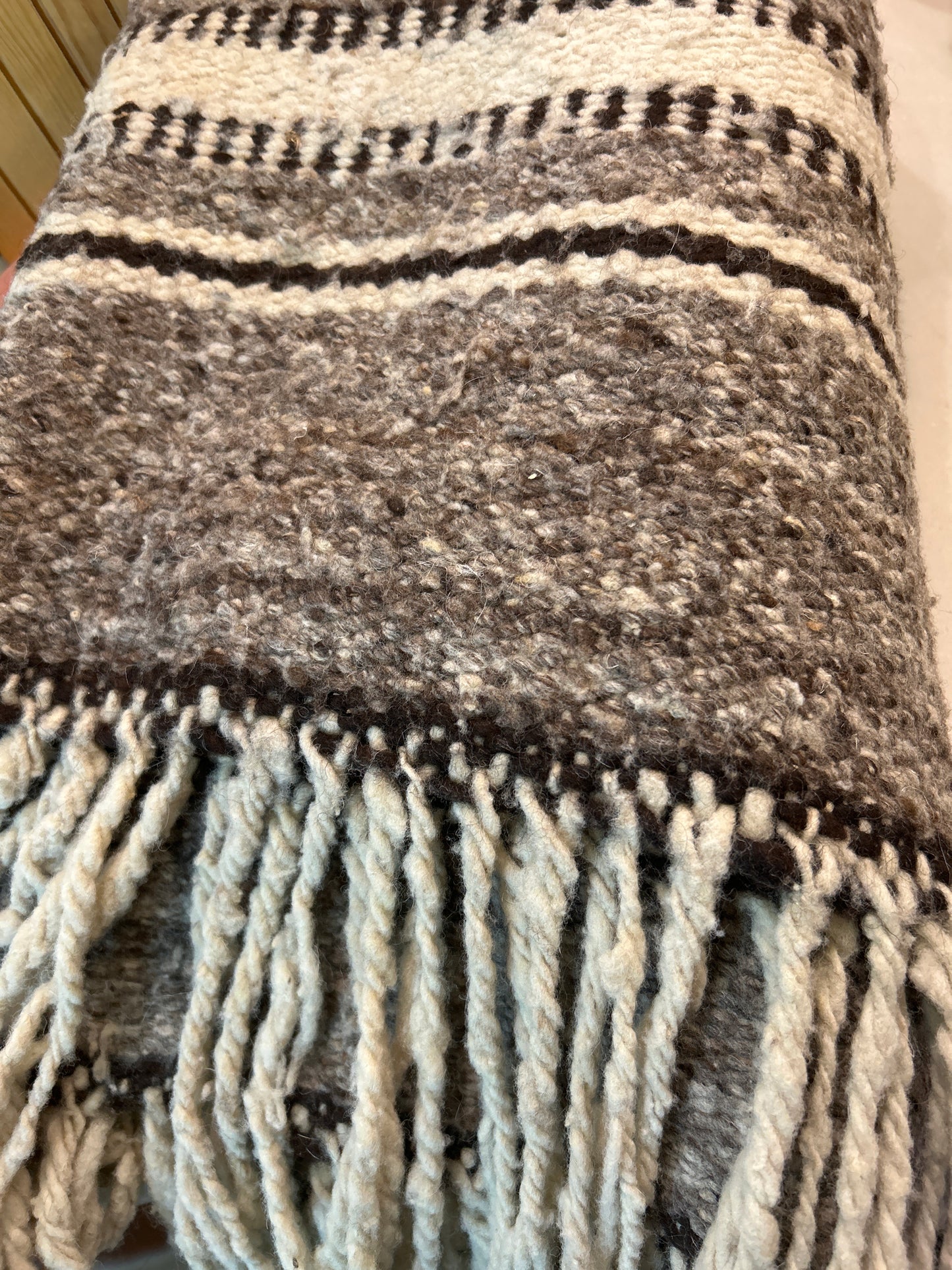 Brown wool rug with fringe