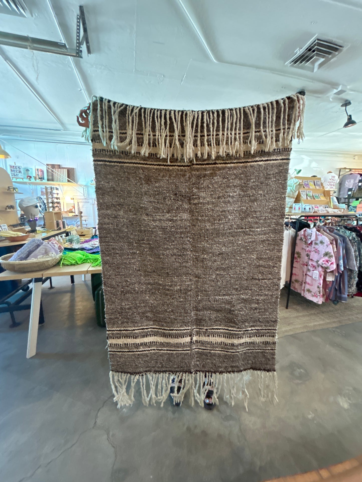 Brown wool rug with fringe