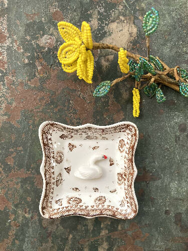 Trinket dish with clay bird figurine