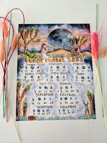 2023 Lunar Wall Calendar with desert themes like Joshua Trees, moon, mountains, cactuses, and desert animals sized 8.5x11"