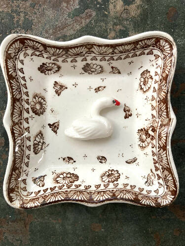 Trinket dish with clay bird figurine