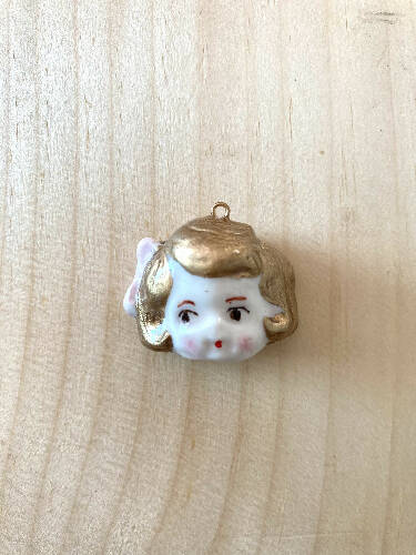 Doll head charm/pendant