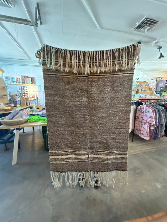 Brown wool rug with fringe